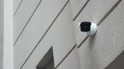 Security Camera Monitors Building Entrance Area