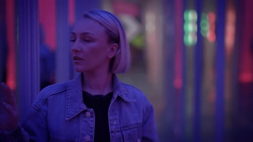 Young Blond Woman Exploring Room of Mirrors in Dreamlike Fantasy Neon Light