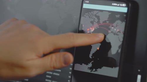 Hand Interacting with World Map on Smartphone