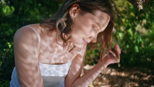 Thoughtful Girl Resting Nature Forest Reflecting Sun Shadows on Face Closeup