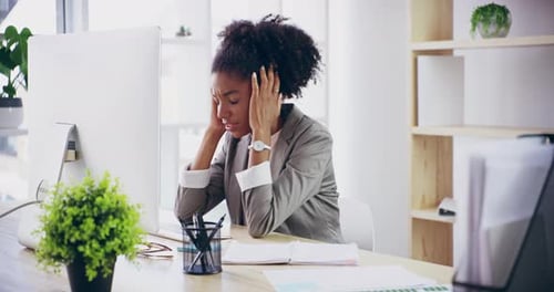 4k video footage of a young attractive businesswoman working in her office