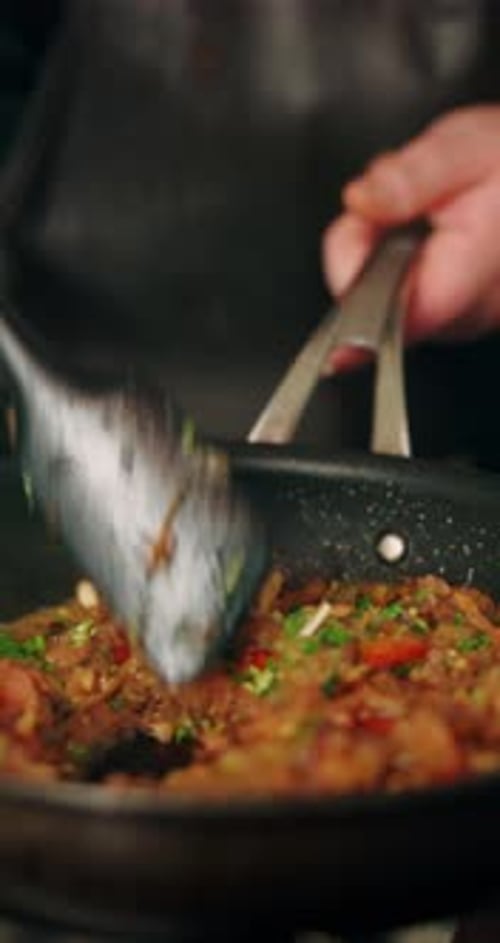 Cooking meat and vegetables in the kitchen