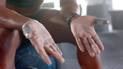 Applying chalk on hands, woman preparing for weightlifting in gym, copy space