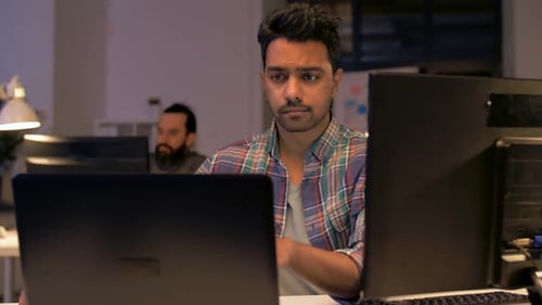 Deadline, Technology and People Concept - Creative Man or Programmer with Laptop