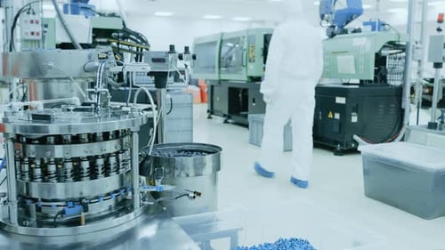 On a Factory Scientist in Sterile Protective Clothing Work on a Modern Industrial 3D Printing Machi