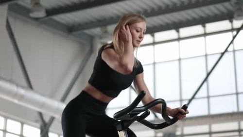 Closeup View of a Blondehaired Woman Sweating in a Gym