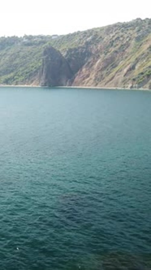 Aerial Vertical View of Seascape with Crystal Clear Azure Sea and Rocky Shores A Beautiful Lagoon on