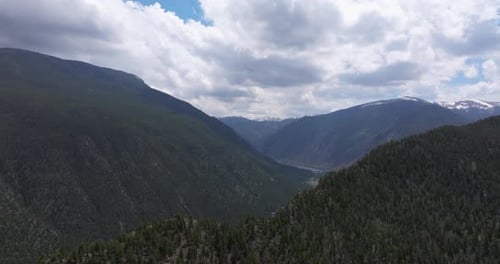 Wide drone shot of mountain tops