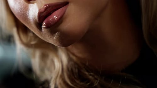 Woman's Glossy Lips in a Close Up Shot