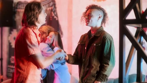 Young People Gathering Together in Night Club