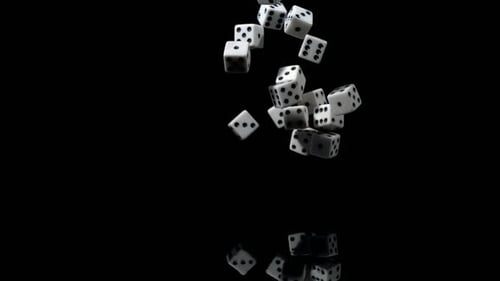 Falling dice on a reflective black surface