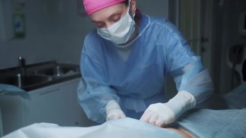 Surgeon Performing Surgery in Sterile Hospital Environment