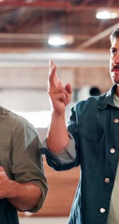 Men, carpenter and tablet at warehouse, talk and point for choice with order for construction