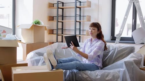 Moving, People and Real Estate Concept - Happy Smiling Asian Woman With