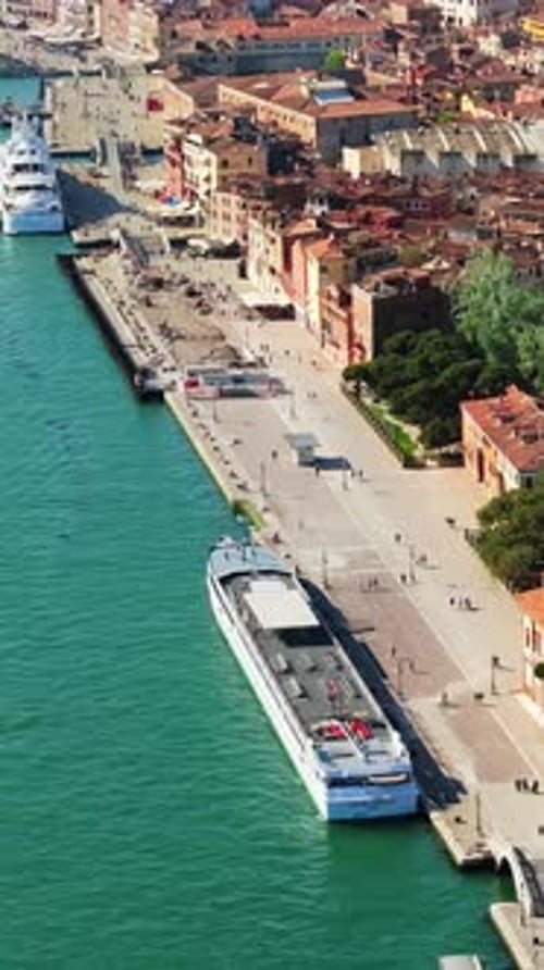 Aerial drone view of boats near Venice City, Italy on a sunny day. Vertical