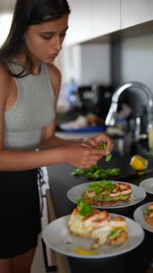 Woman Preparing Gourmet Sandwiches in Modern Kitchen