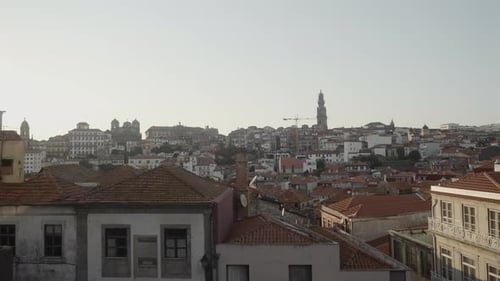 Beautiful view of ancient city with red roofs. Action. Old European city in morning sun.