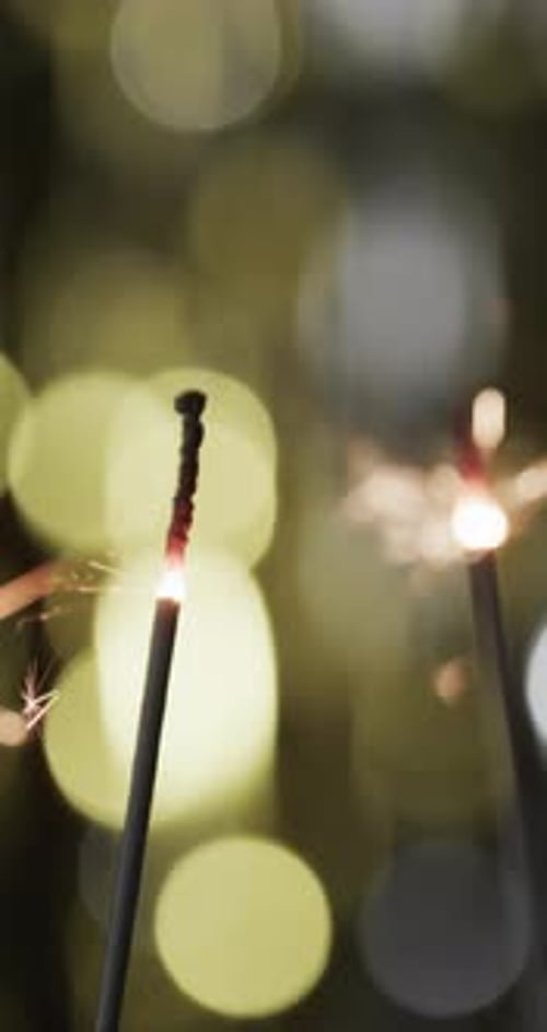 Sparklers at Night with Golden Bokeh