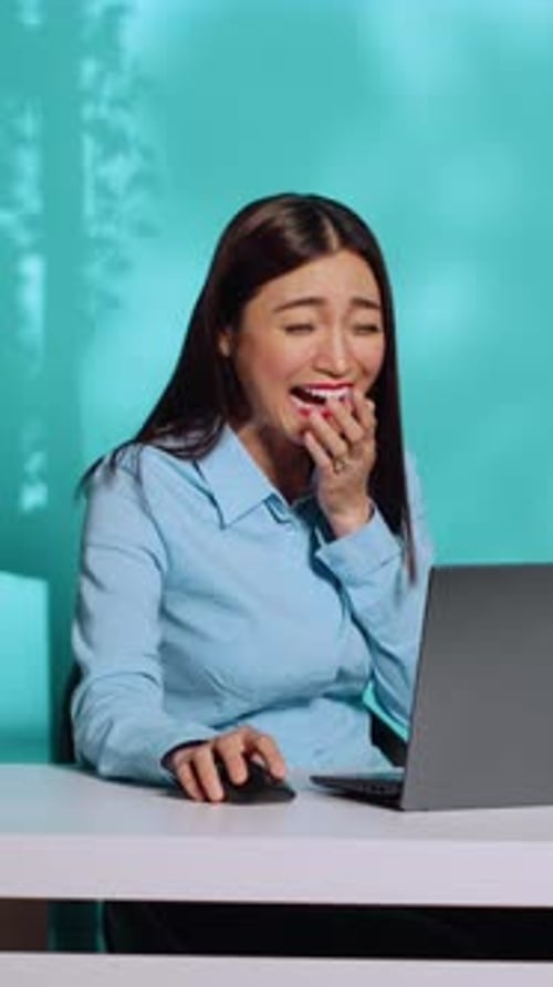 Cheerful Employee Laughting at Work