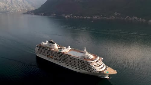 Large cruise ship passing through the picturesque bay of Kotor in Montenegro