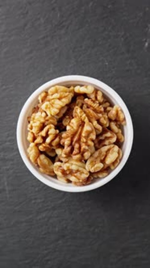 Bowl of Tasty Walnut Halves Close Up