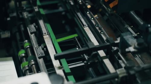 Closeup Of Industrial Printer Mechanisms Processing Paper With Precision And Speed