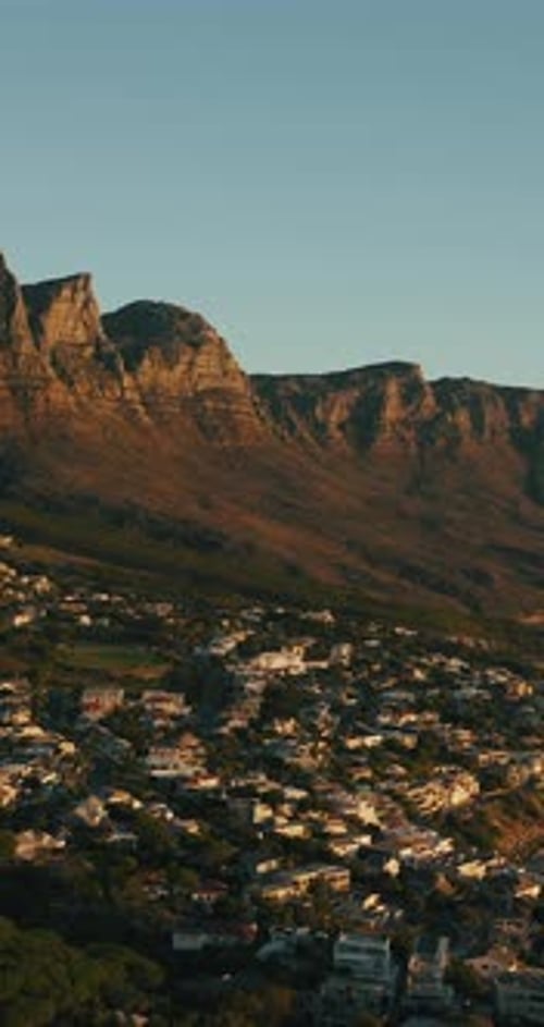 Aerial, landscape and mountain with city in nature for travel, urban skyline and holiday location