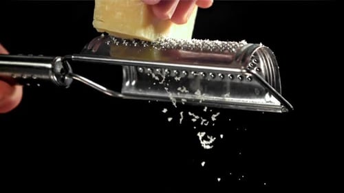 A Chef Grates Parmesan Cheese Filmed on a Highspeed Camera at 1000 Fps
