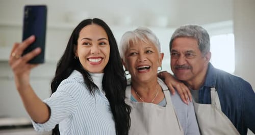Happy Family Laughing and Taking a Selfie