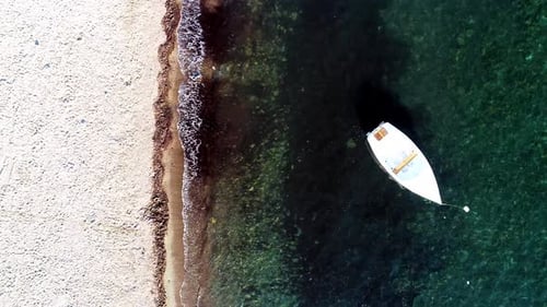 full aerial view of boat moored on empty beach
