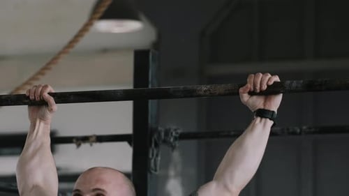 Closeup Muscular Young Handsome Caucasian Man Doing Chinup Exercises During Extreme Workout in Large