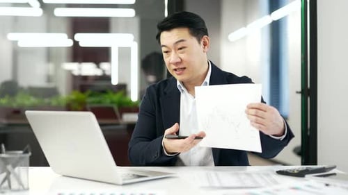 Man Explains Chart During Online Meeting