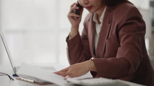 Business Woman Working at Desk, Talking on Phone