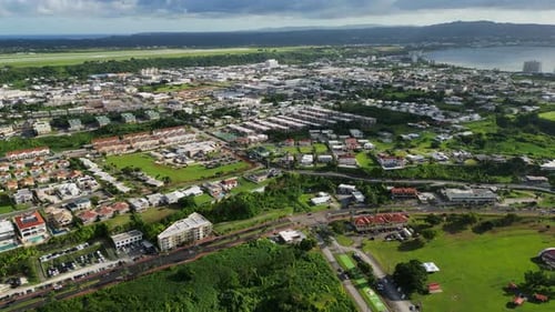 Tropical Coastal Town Aerial View Residential Homes and Green Landscape