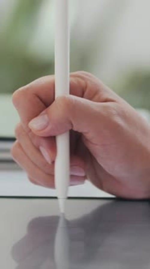 Close Up Hand Using Tablet Pencil