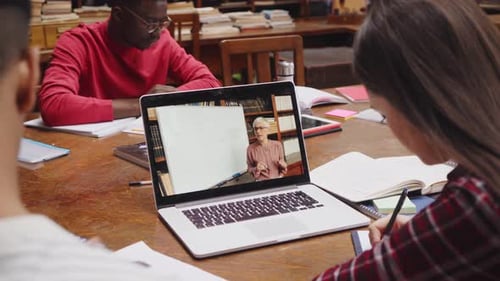 University students learn online with professor teaching a video lesson