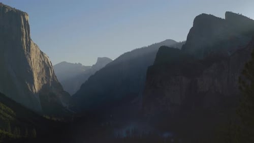 The Sun Is Shining Through The Mountains In Yosemite National Park Half Dome