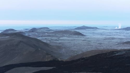 Dark black rock flowing downhill from inactive Geldingadalsgos volcano, Iceland
