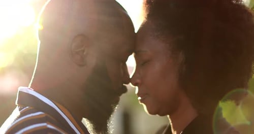 Loving Couple Touching Foreheads at Golden Hour Outdoors