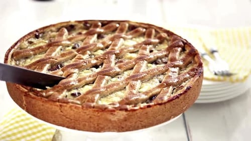 Cutting a Crusty Lattice-Topped Pie on a Stand