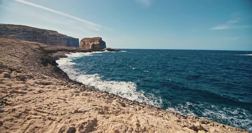 Slow Motion Video of Seascape of Waves From the Ocean Crashing on a Rocky Shore