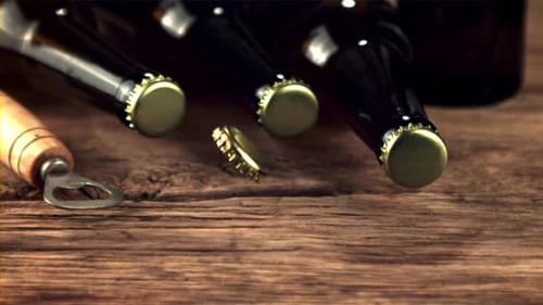 The Super Slow Motion Tin Lid From the Beer Bottle Falls on the Table and Rotates Filmed on a