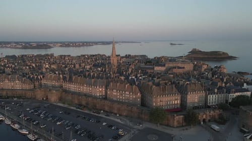 Saint-Malo city with Cathedral bell tower and surrounding landscape at sunset, Brittany in France. A