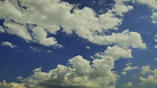 rapid movement of clouds in the blue sky