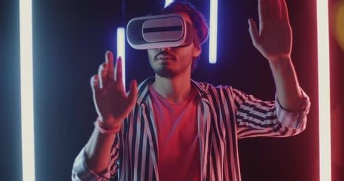 Young Adult Using Virtual Reality Headset in Modern Setting