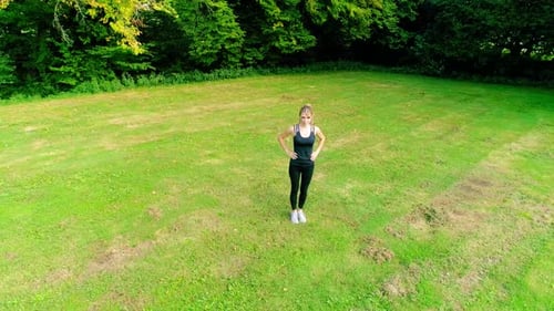 4k shot of young beautiful women doing exercises outdoor in a park at sunrise