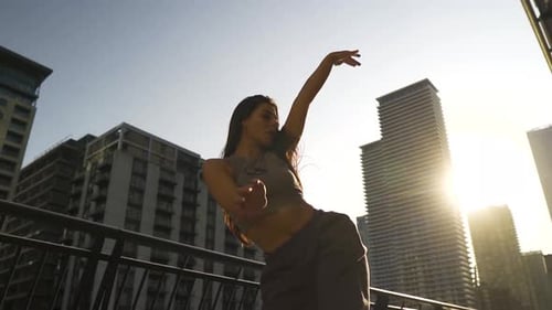 Young Woman Dancing in an Urban Setting