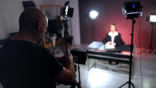 Woman Recording Content in Brightly Lit Studio