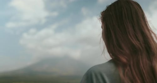 Woman with Long Hair Looking at Mountain View