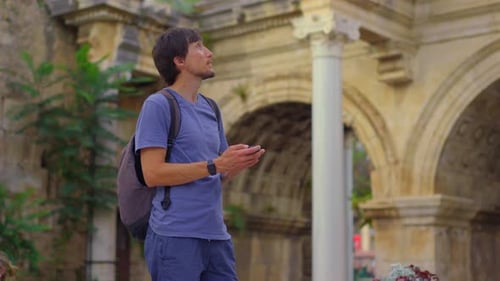 In This Captivating Video a Young Man Tourist is Portrayed Visiting the Renowned Tourist Attraction